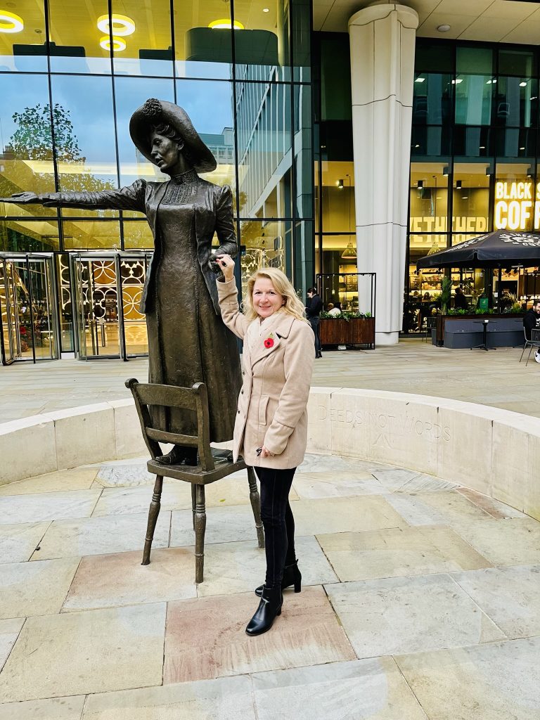 Emma Guy Reform Mid Cheshire with Emily Pankhurst statue in Manchester